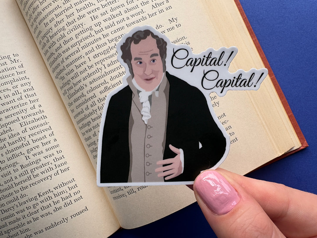 A cartoon of Sir William Lucas from Pride and Prejudice 1995 with the text 'Capital! Capital!'. Held over an open book on a blue background.