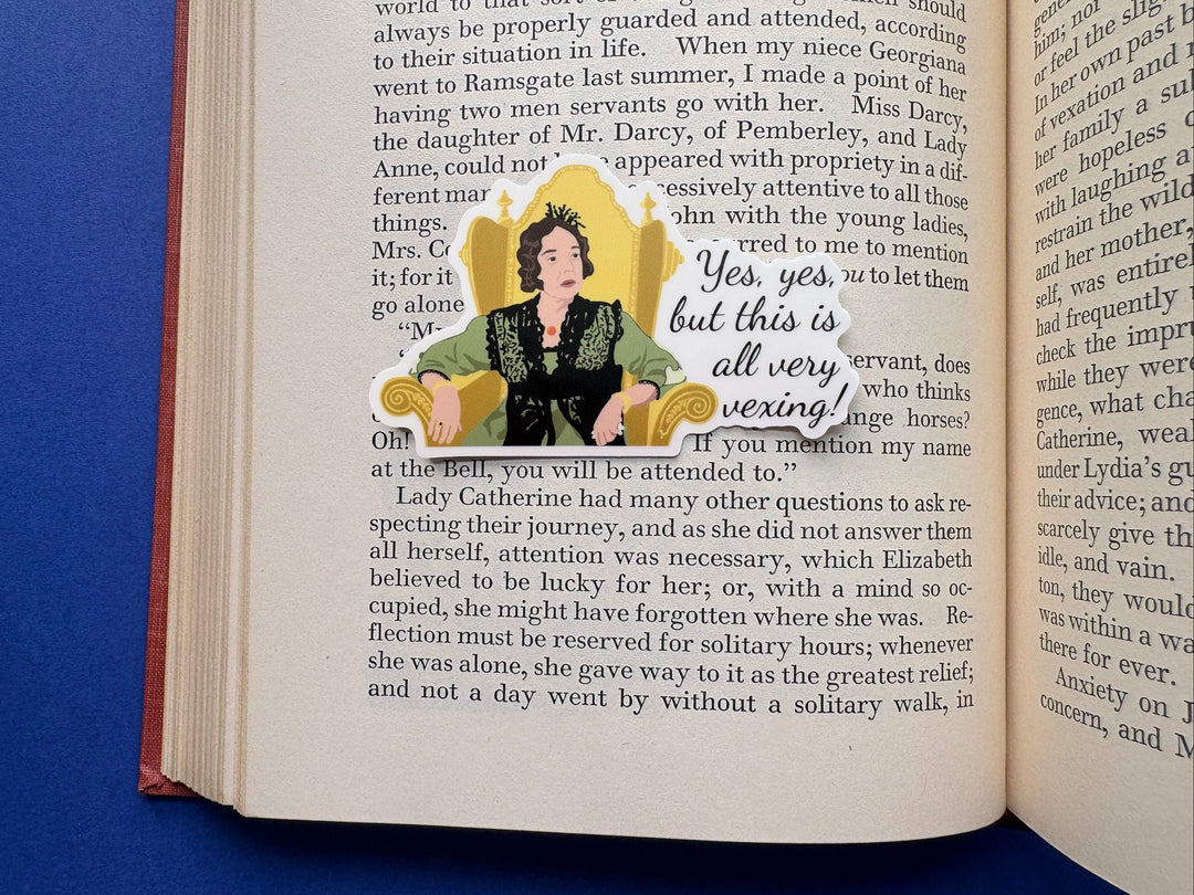 A cartoon of Lady Catherine from BBC Pride and Prejudice 1995 with the text 'yes, yes, but this all very vexing!'. She is sitting in a gold chair and wearing a green dress. The sticker is on a book resting on a blue background.