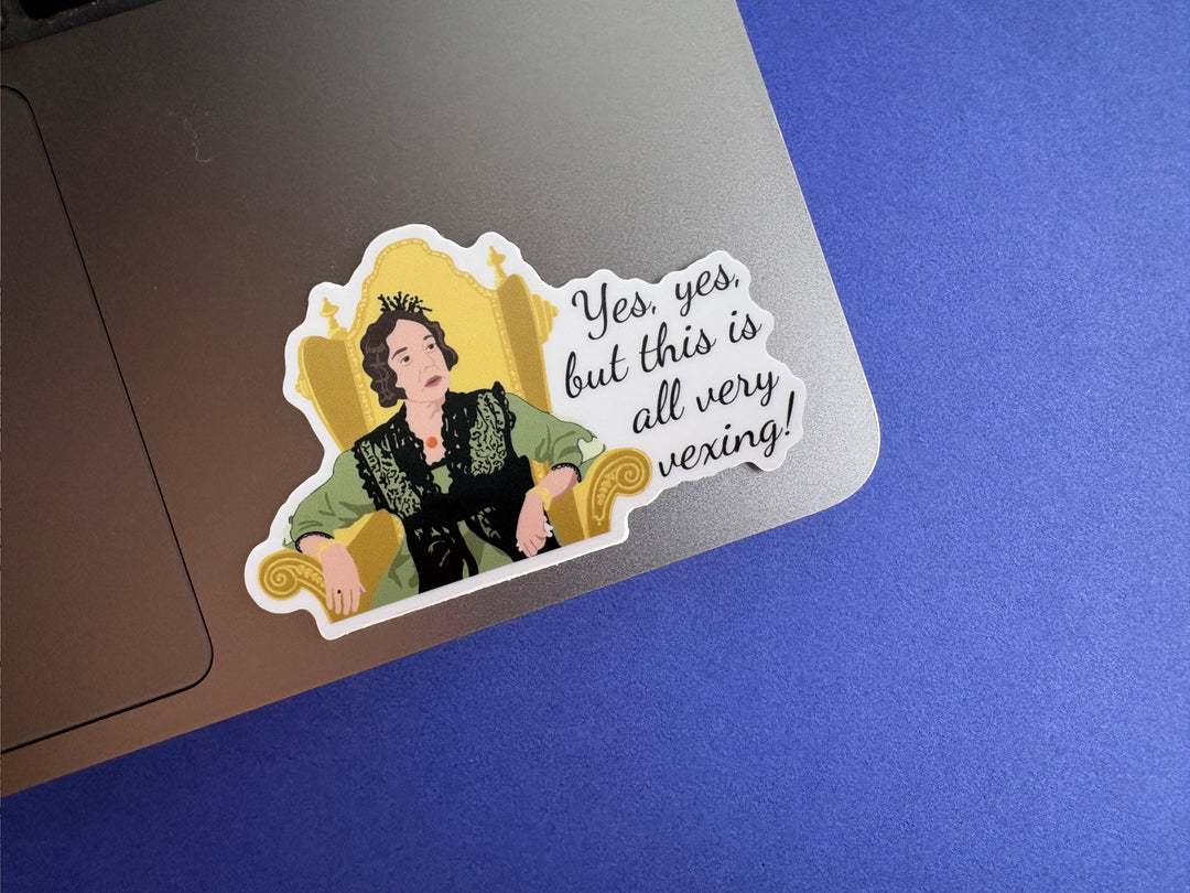 A cartoon of Lady Catherine from BBC Pride and Prejudice 1995 with the text 'yes, yes, but this all very vexing!'. She is sitting in a gold chair and wearing a green dress. The sticker is on a silver laptop resting on a blue background.