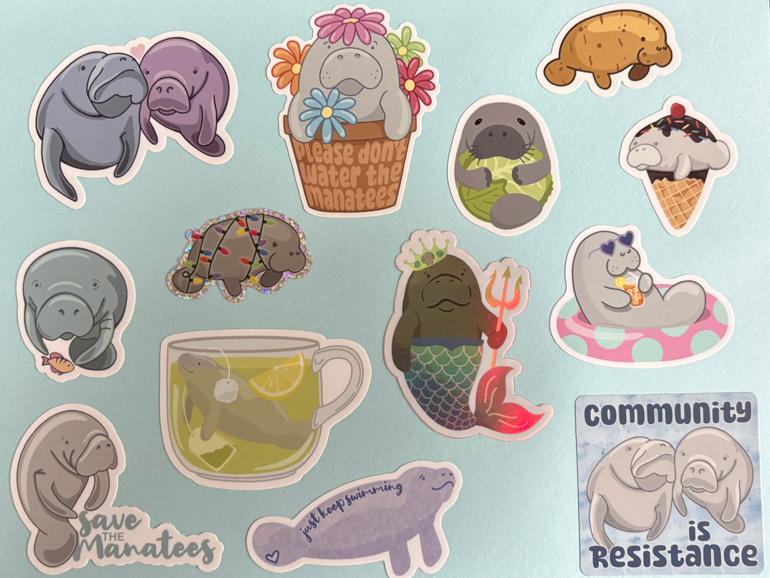Thirteen different manatee stickers are shown on a light blue background.