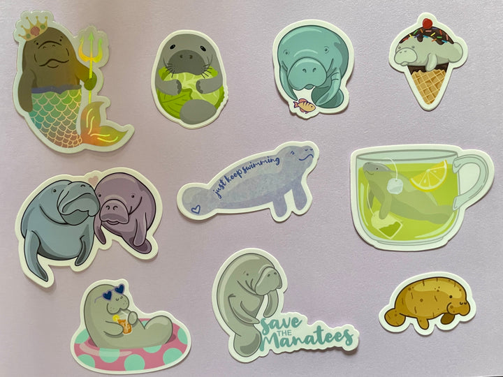Ten different manatee stickers are shown on a purple background.